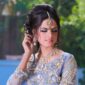 South Asian bride in traditional bridal attire and jewellery